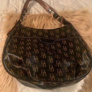 DOONEY AND BURKE BLACK AND GOLD BAG.